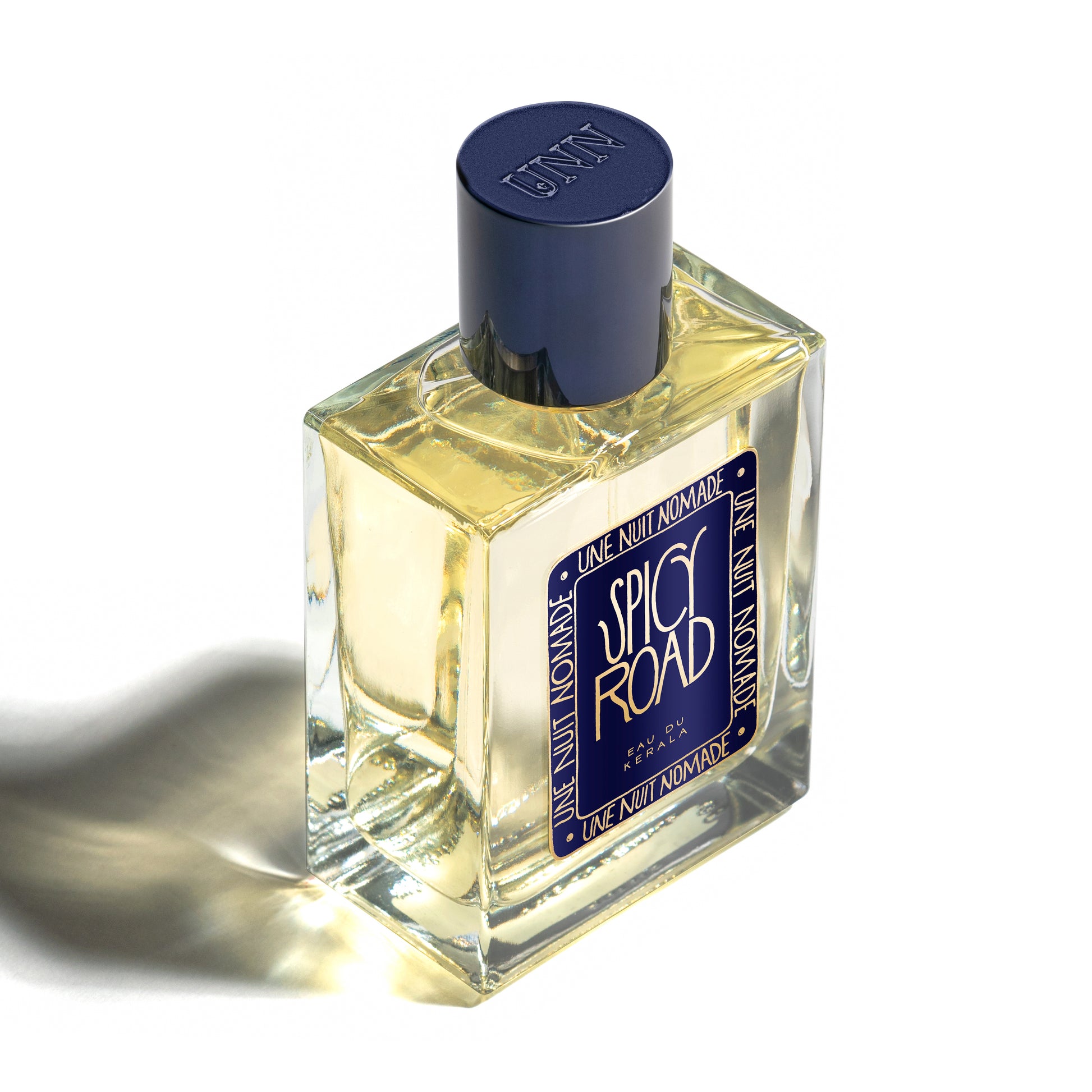 Perfume bottle labeled 'Spicy Road' by 'Une Nuit Nomade' on a white background