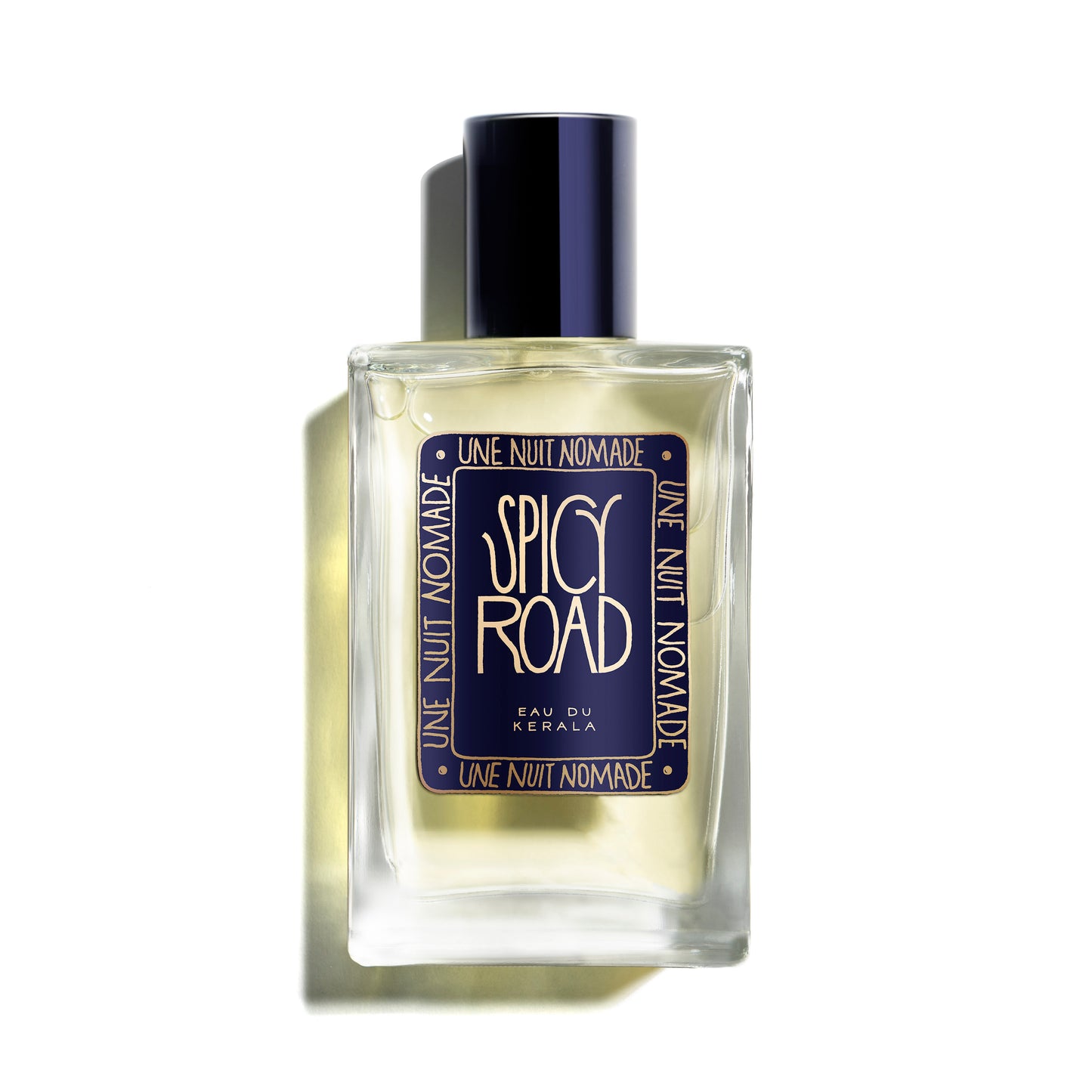 Perfume bottle labeled 'Spicy Road' by 'Une Nuit Nomade' on a white background