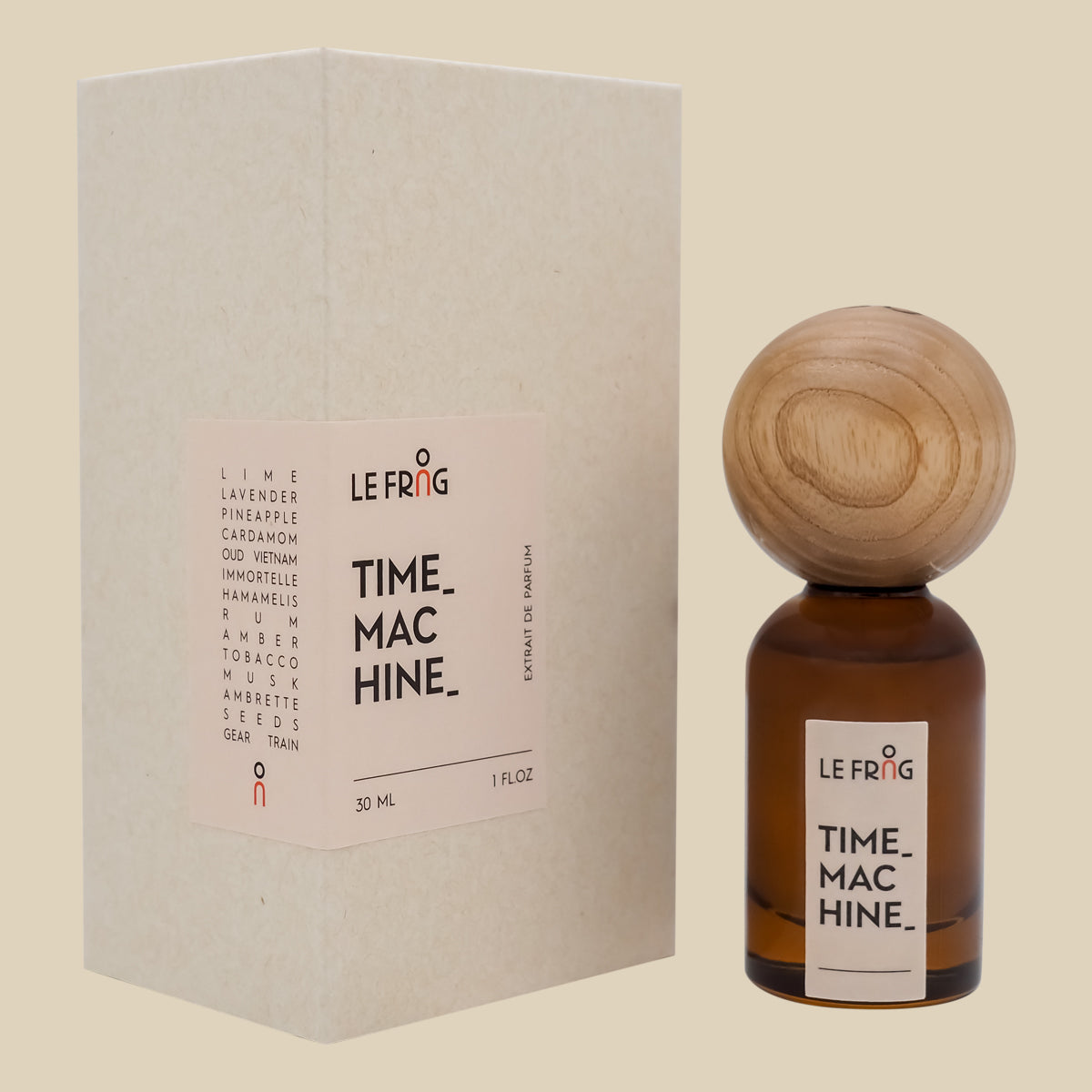 Le Frag Genesis perfume bottle with wooden cap and packaging on a beige background